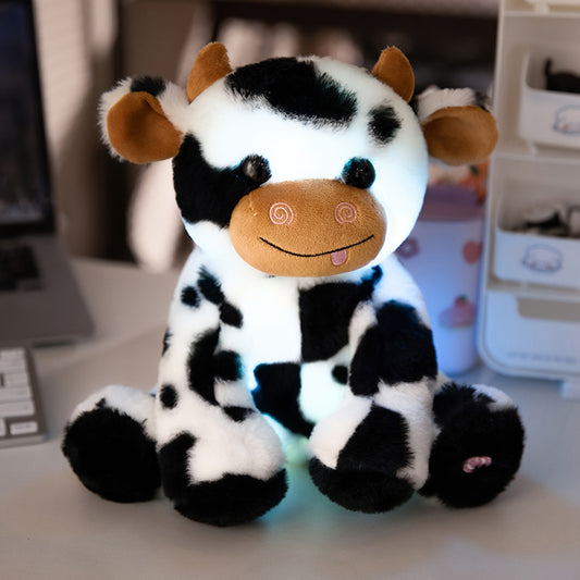 Adorable LED plush cow with glow-in-the-dark feature, soft polyester blend, perfect for kids, toddlers, and holiday gifts.