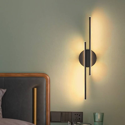 Modern LED wall sconce in sleek black finish with adjustable warm and cool white light options, perfect for any interior space