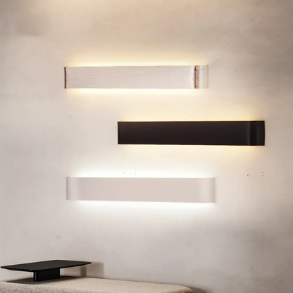 Modern Nordic LED wall sconce with brushed aluminum finish in living room setting.