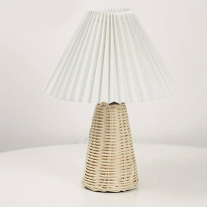 Rattan lamp with pleated shade, perfect for bedroom decor, offering soft and warm lighting for a cozy ambiance.