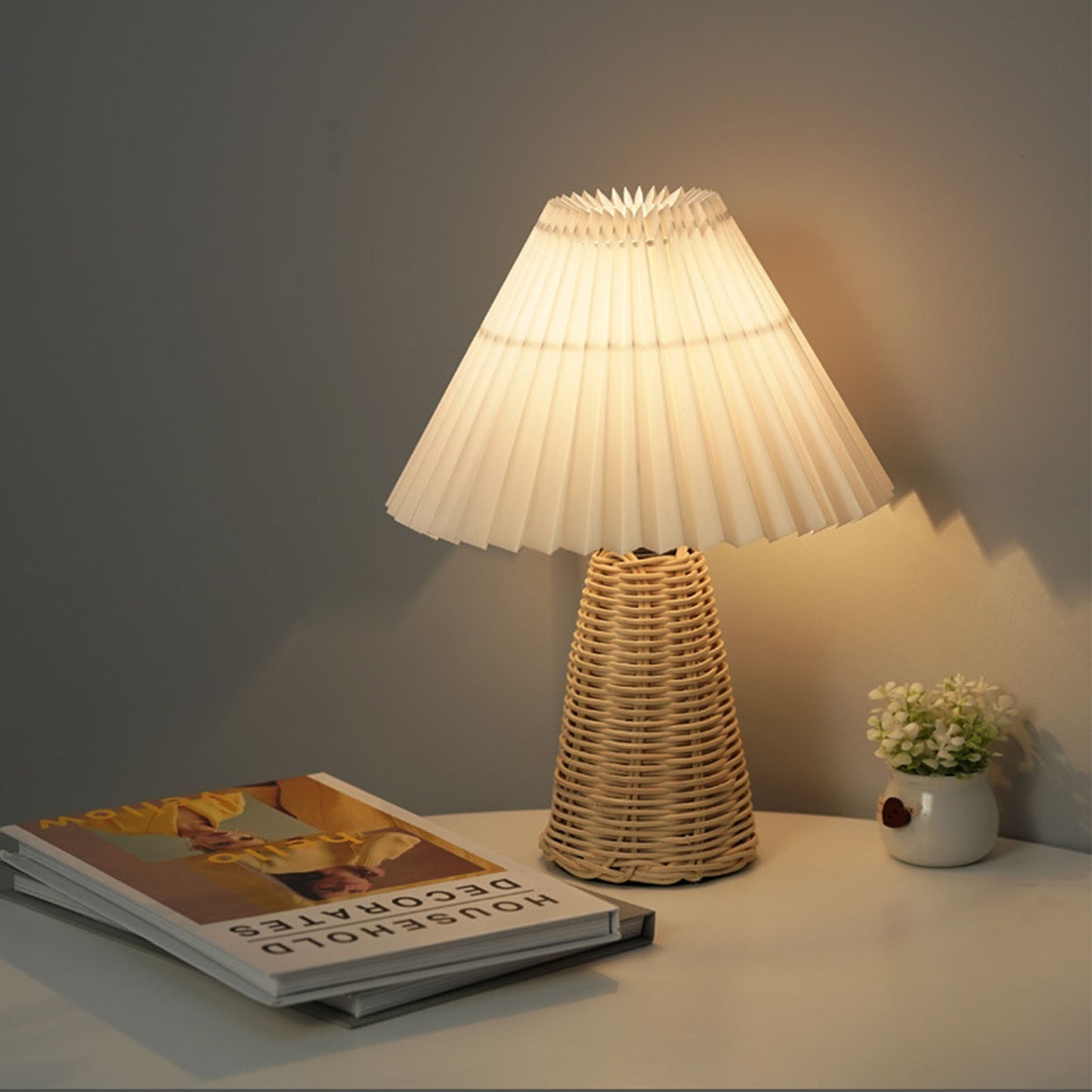 Rattan lamp with pleated shade, perfect for bedroom decor, offering soft and warm lighting for a cozy ambiance.