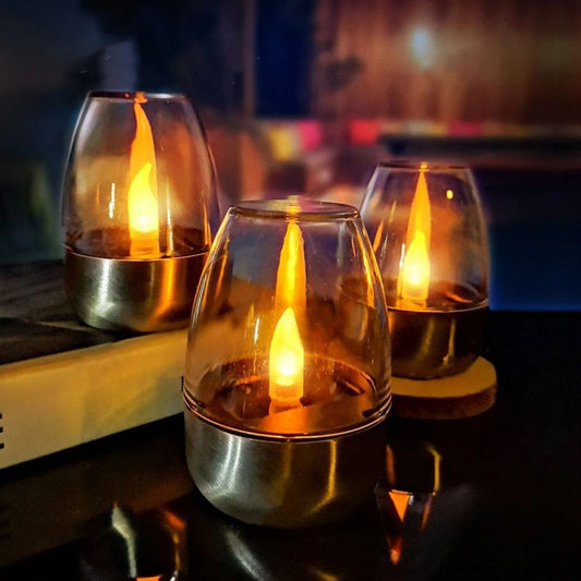 Solar-powered LED glass candle, waterproof flickering candlelight, elegant outdoor and indoor decor, LuxRoyale solar candle with warm glow, holiday lighting solution.