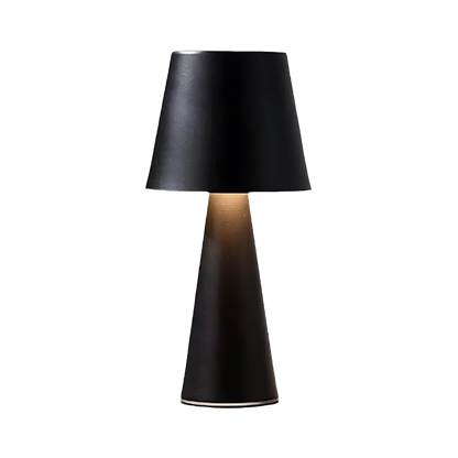 Sleek rechargeable table lamp with dimmable LED light, metallic finish, and wireless convenience, perfect for modern decor.