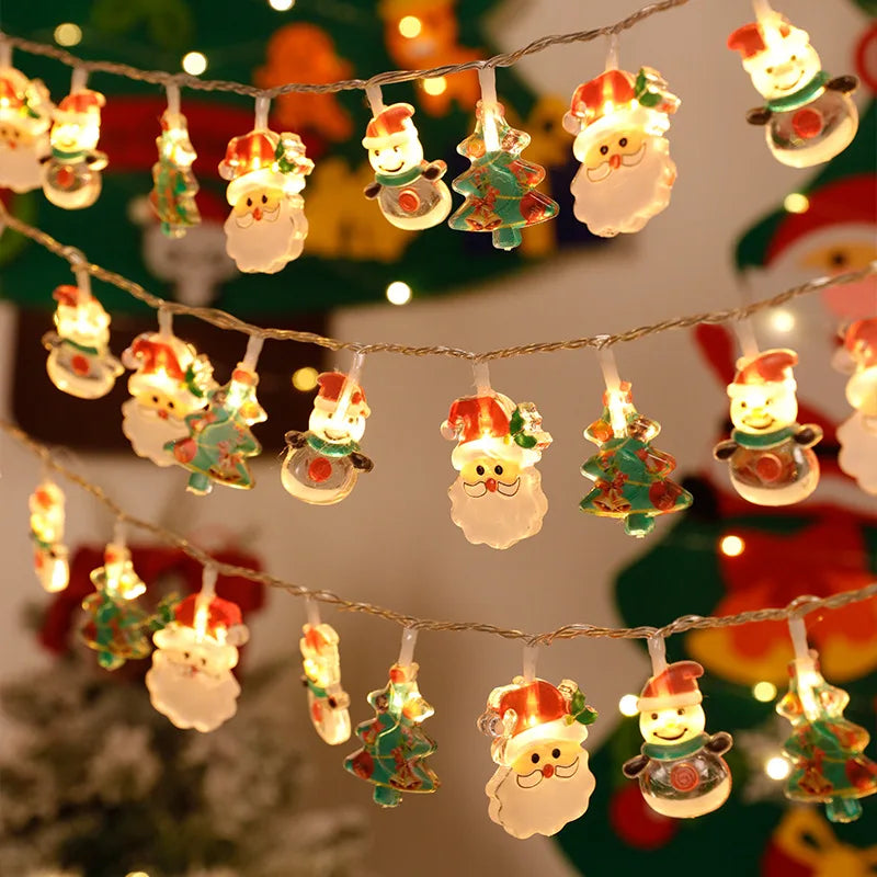 Battery-operated Christmas lights with Santa Claus, snowman, and tree designs, warm white LED garland ideal for holiday decorations.