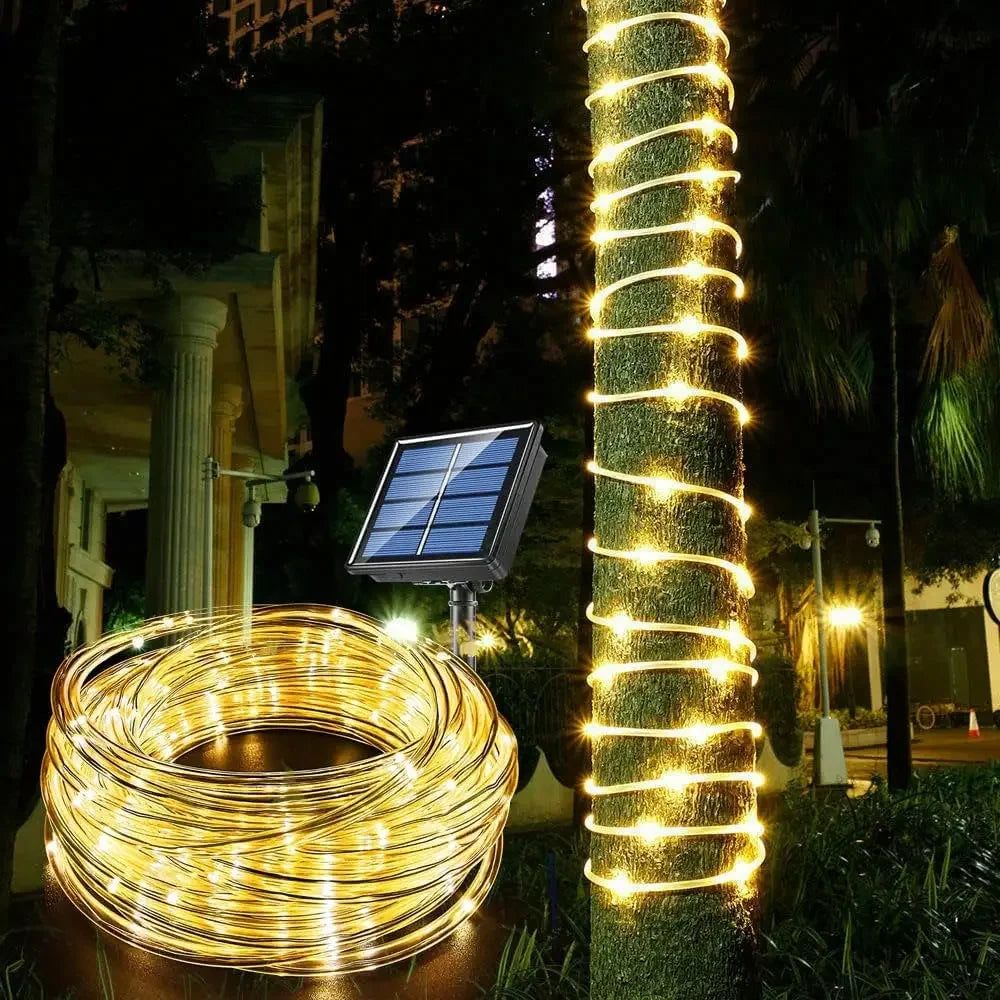 Solar-powered 300 LED rope lights perfect for outdoor Christmas decorations, lighting up gardens, pathways, and trees.