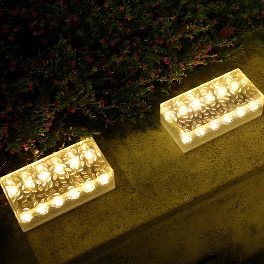 Modern solar brick lights illuminating a garden path with warm or white LED glow, durable and eco-friendly for outdoor use.