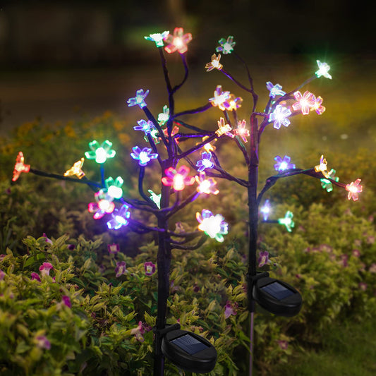 Solar-powered multicolor flower lights, Lumora FairyFlowers garden decor, vibrant LED flower stakes for outdoor use, whimsical garden lighting with solar power.