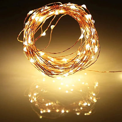 Battery-operated Christmas lights with LED bulbs on flexible copper wire, perfect for indoor and outdoor holiday decor, weddings, and parties.