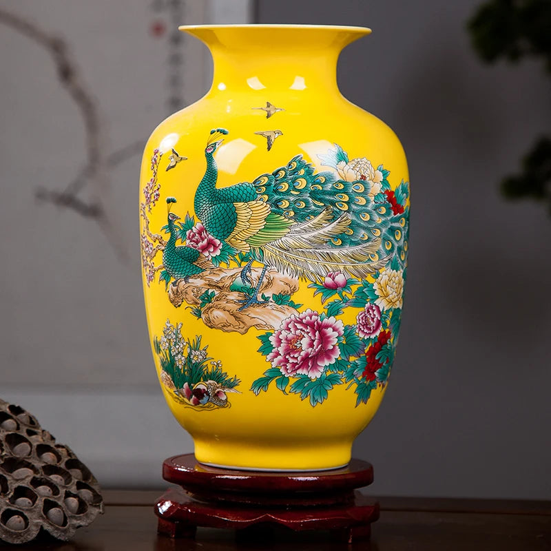 Vibrant yellow ceramic vase featuring a hand-painted peacock and floral design, perfect for home decor.