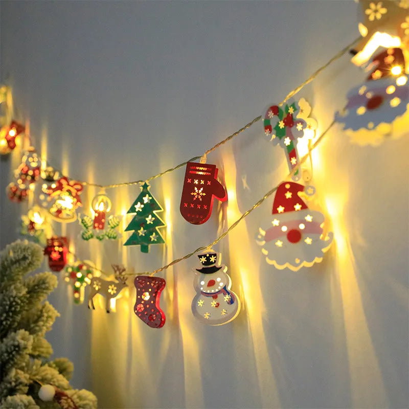 Battery-operated Christmas lights featuring warm white LED bulbs and holiday-themed decorations like fawn, gloves, and bells, perfect for indoor holiday decor.