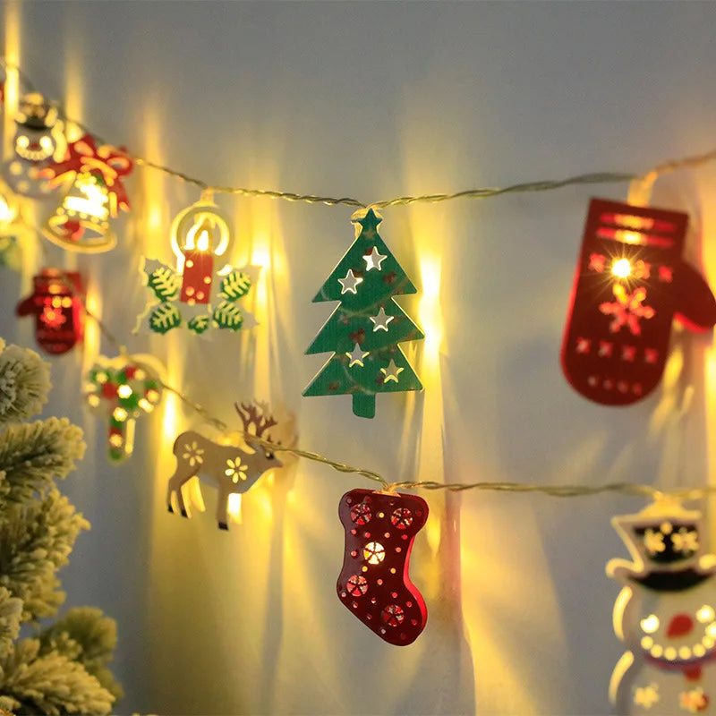 Battery-operated Christmas lights featuring warm white LED bulbs and holiday-themed decorations like fawn, gloves, and bells, perfect for indoor holiday decor.