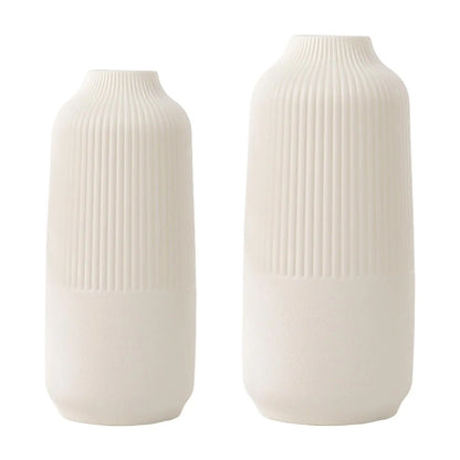 Two sizes of white modern Nordic flower vases displayed elegantly, showcasing their minimalist design.