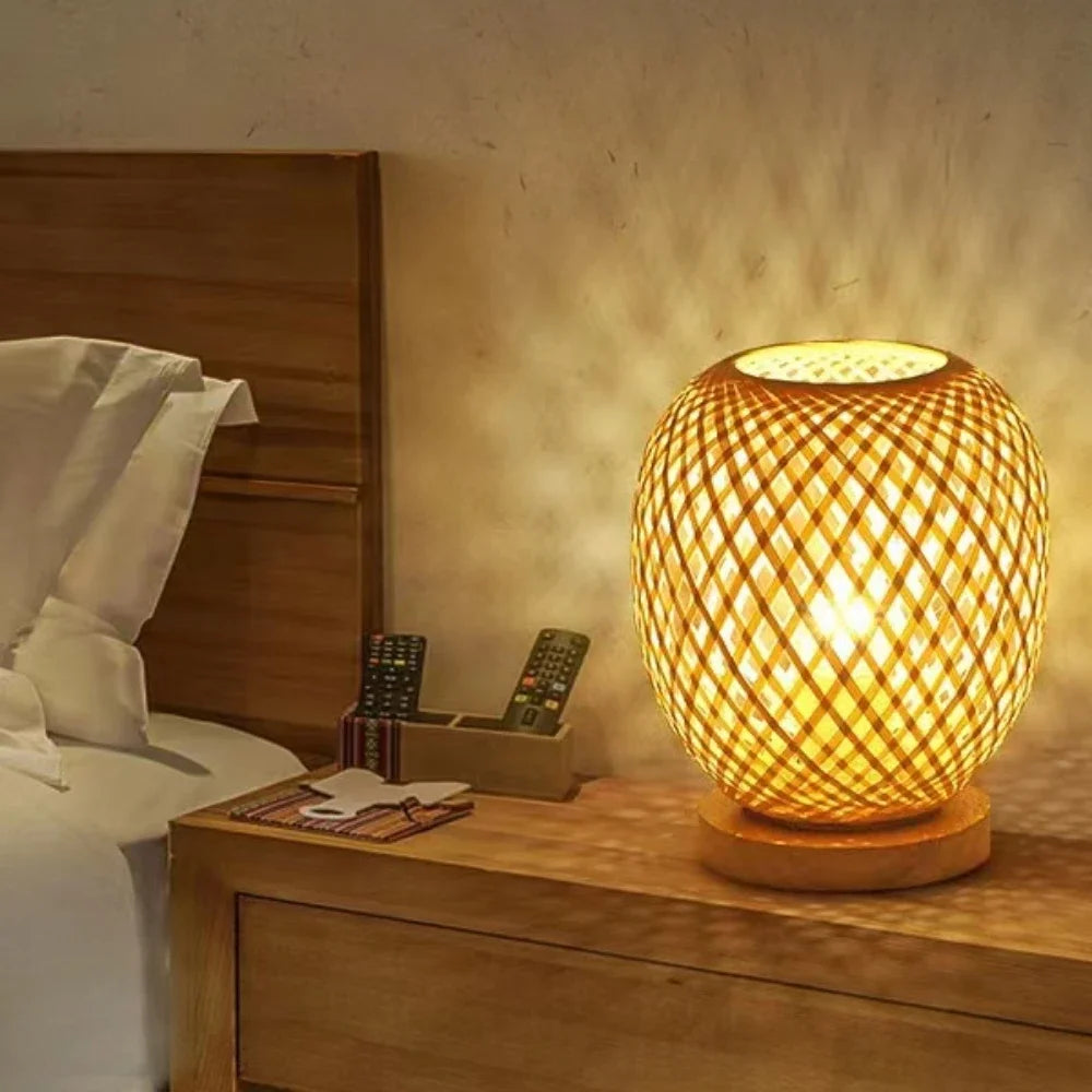 Handmade rattan table lamp with natural wooden base, perfect for rustic home decor and cozy bedside lighting.