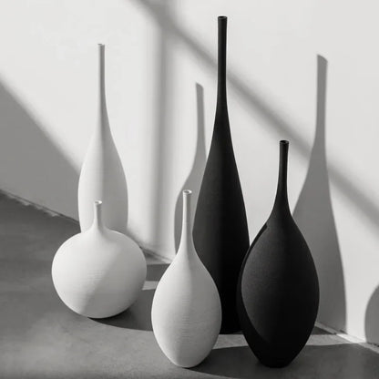 Minimalist Zen ceramic vases in black and white, perfect for modern home decor and floral arrangements.