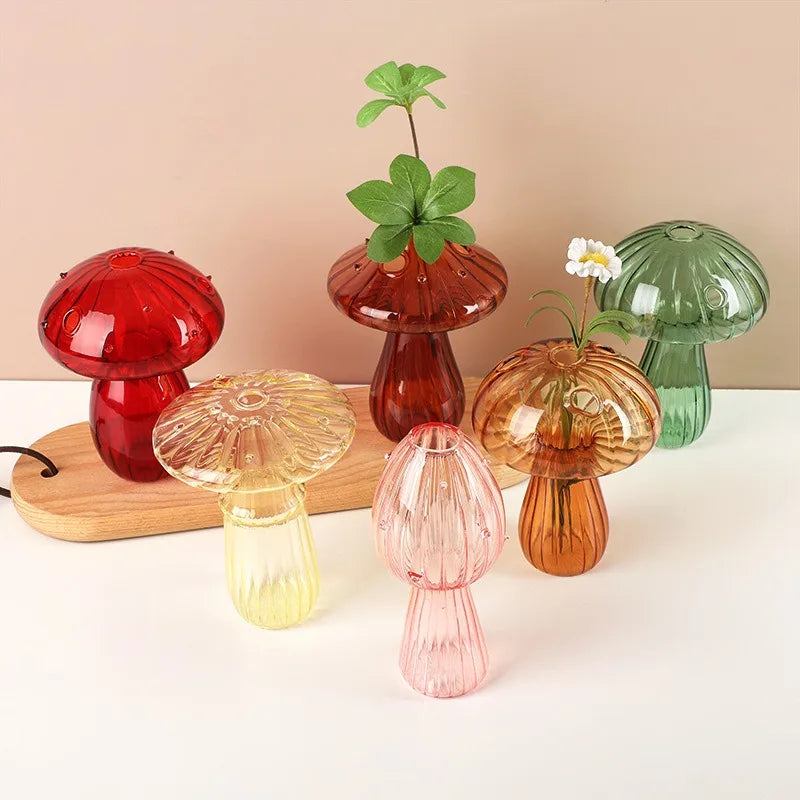 Colorful mushroom-shaped glass vases in jelly tones, perfect for home decoration or flower arrangements.