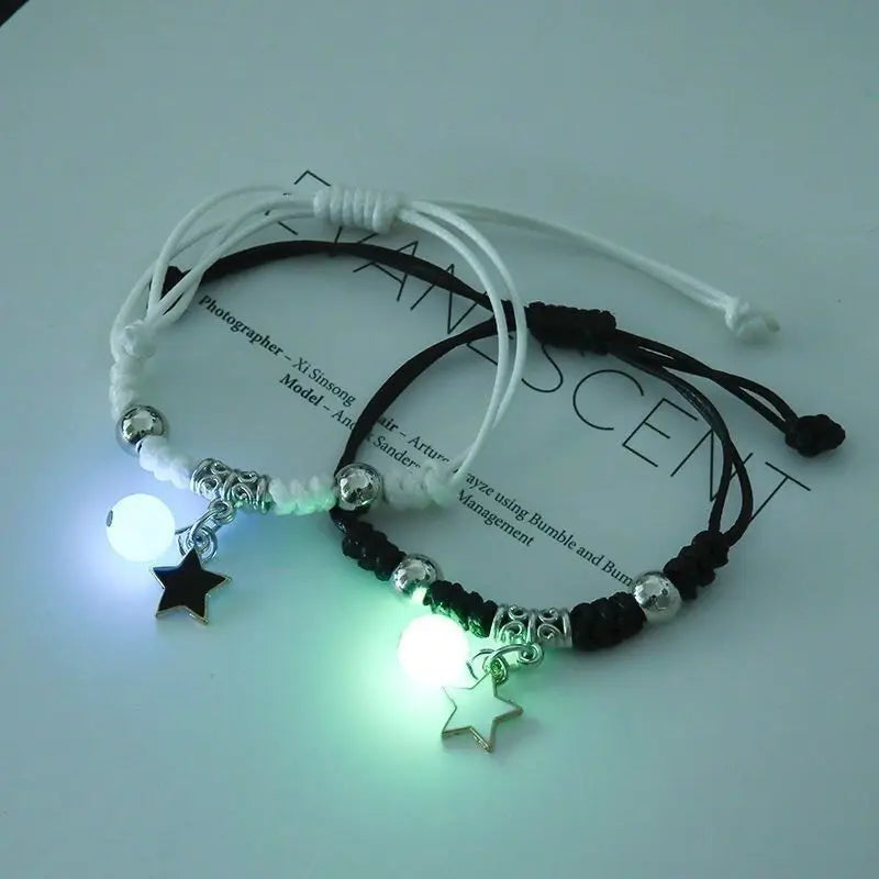 Luminous star couple bracelets with glow-in-the-dark beads and star pendants, featuring adjustable rope design, perfect for couples and friends.