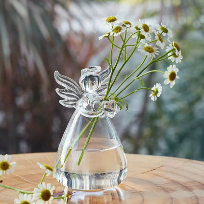 Set of transparent glass vases in angelic designs, beautifully arranged with daisies, perfect for table and desk decoration.