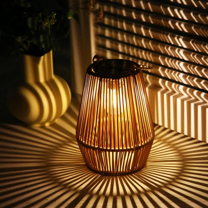 Handwoven solar garden light casting intricate patterns with warm LED glow, perfect for outdoor villas, gardens, and landscapes.