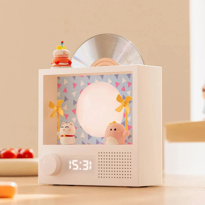 Retro Bluetooth music box with decorative rotating record, RGB ambient lighting, clock display, and high-fidelity stereo sound.