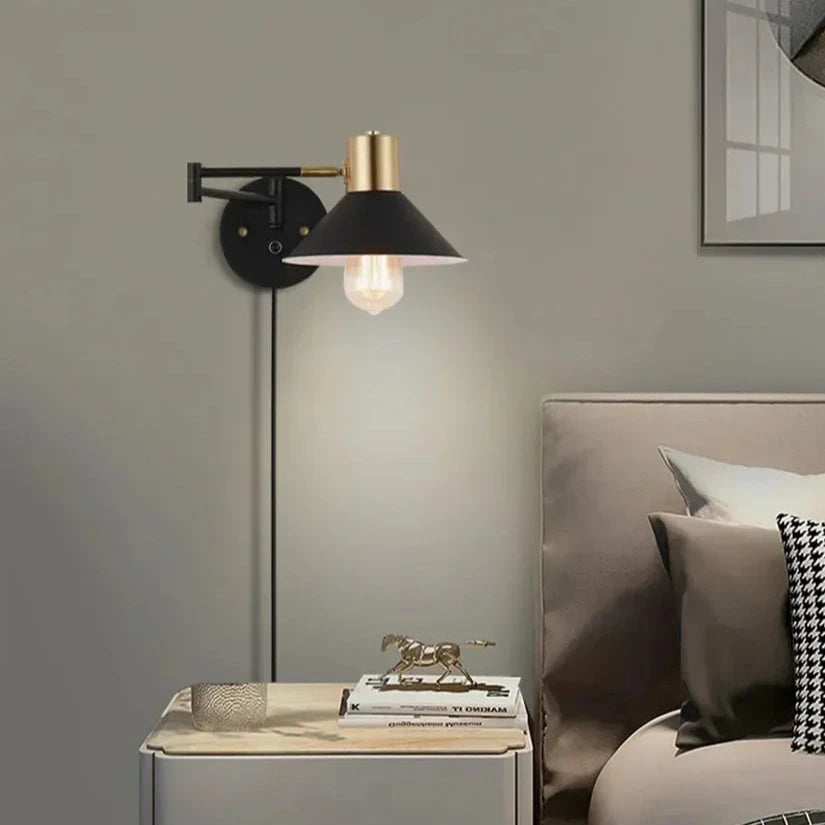 Adjustable dimmable wall sconce with a modern matte black and gold finish, perfect for bedside or study lighting.