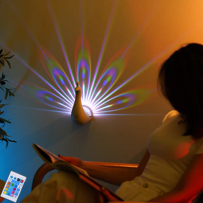 Peacock projection night lamp with colorful feather lighting, featuring touch control, remote dimming, and timer functions, ideal for bedroom décor.