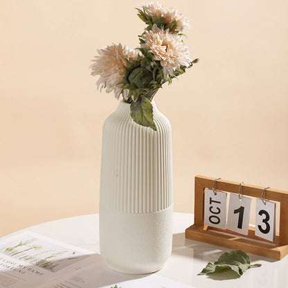 Two sizes of white modern Nordic flower vases displayed elegantly, showcasing their minimalist design.