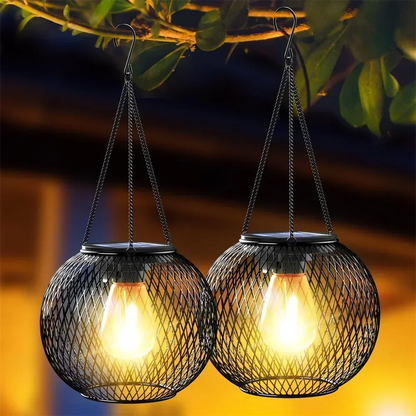 Solar hanging lantern light with warm LED glow, crafted from durable metal, perfect for outdoor garden and patio decoration.