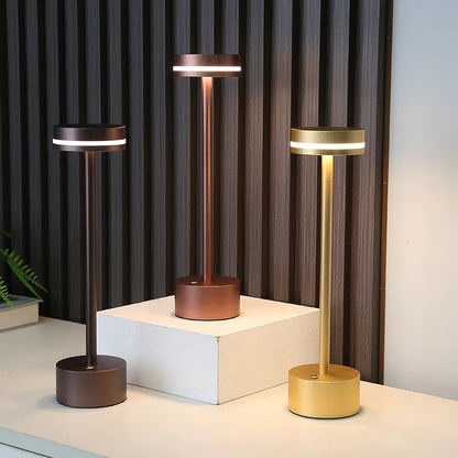 Minimalist LED table lamp with a rechargeable aluminum design, touch-sensitive controls, and adjustable lighting tones, perfect for creating cozy ambiance.