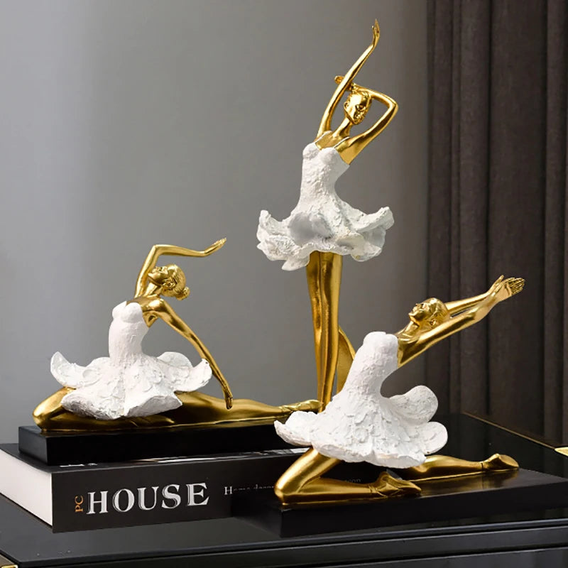 Golden Ballet Girl Sculpture in elegant poses, featuring a luxurious golden finish and delicate white accents, perfect for home décor and gifting.