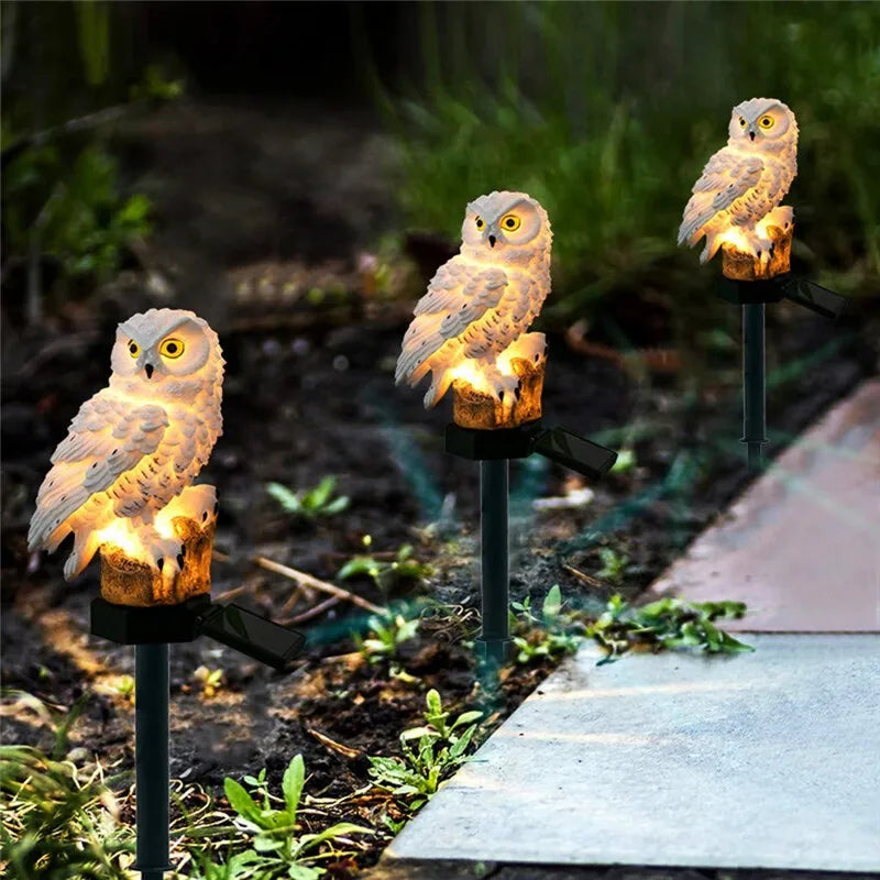 Owl solar garden lights with LED glow, solar-powered outdoor decor, waterproof owl stake light for lawns, patios, and pathways.