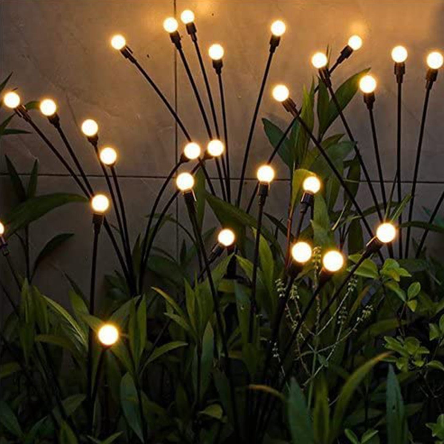 Solar-powered firefly garden lights with swaying warm white LED bulbs, perfect for outdoor ambiance and decorative lighting.