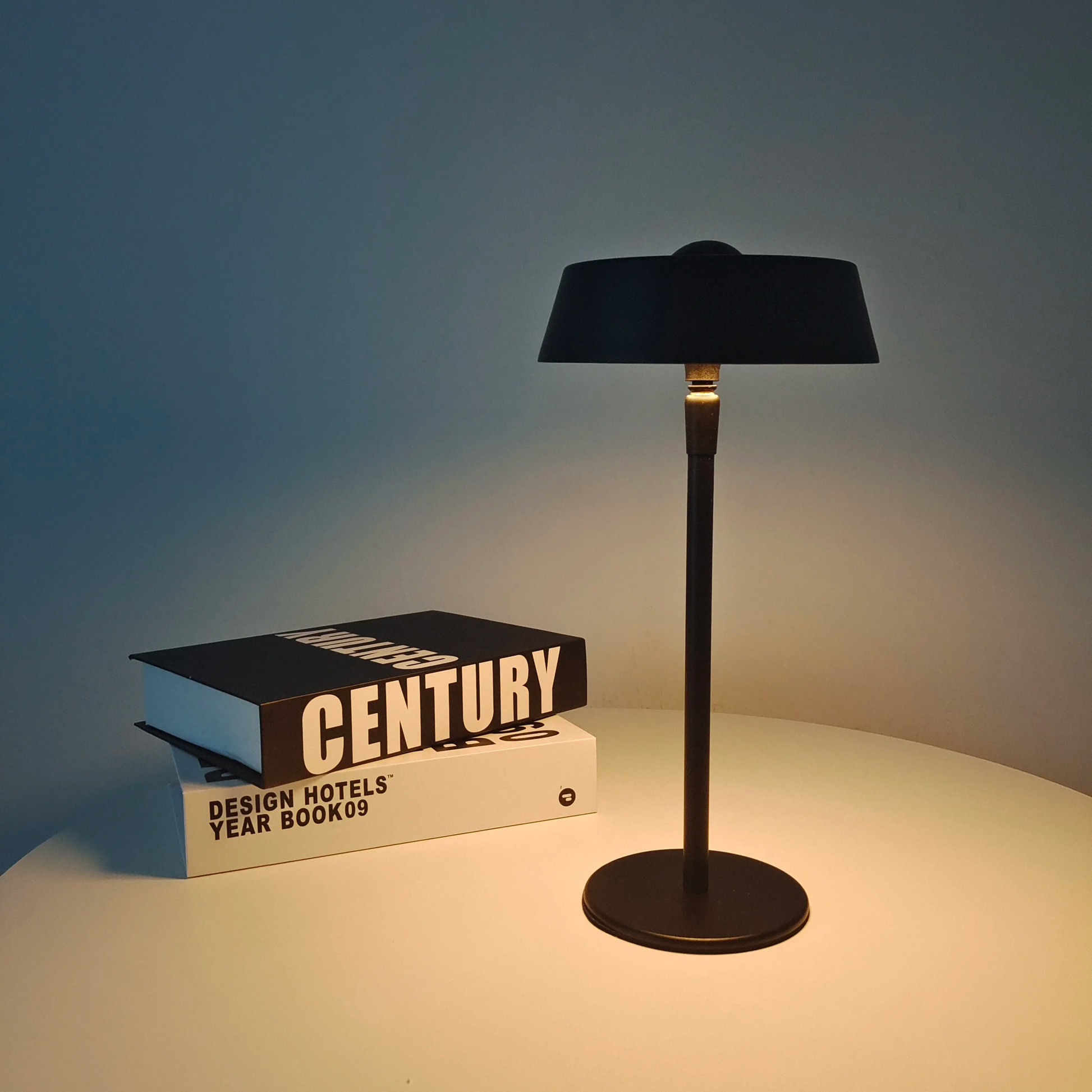 Portable LED table lamp with a touch sensor, designed for modern bedroom and study lighting.