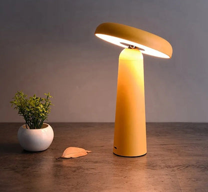 Portable LED desk lamp, rechargeable and cordless design, compact size, and customizable color options.