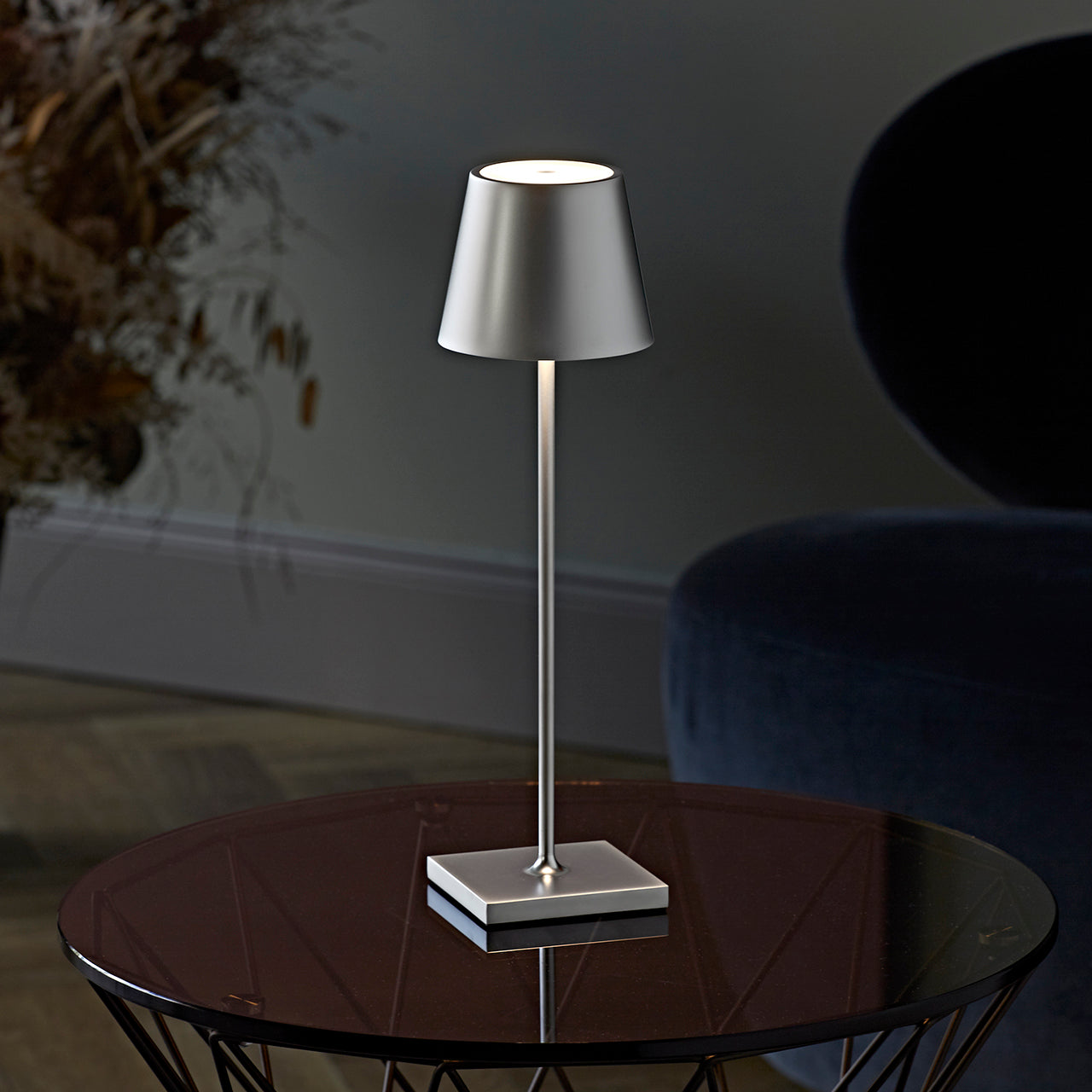 Modern dimmable tall table lamp with a sleek matte finish, touch-activated and USB-C rechargeable, providing adjustable warm lighting