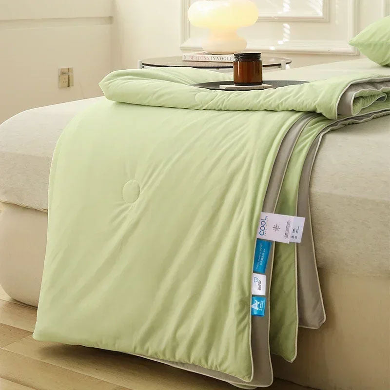 Luxury breathable cooling blanket in a sleek, lightweight design, providing comfort and temperature regulation for restful sleep.