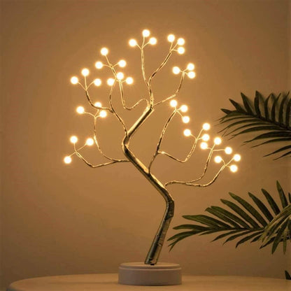 Fairy Tree Lamp with LED lights on flexible branches, perfect for cozy home decor.