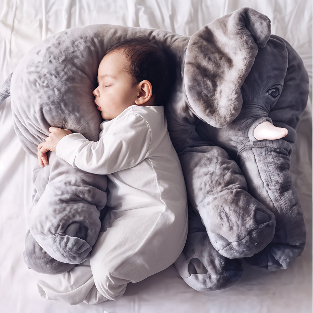 Soft baby elephant cuddle pillow, plush companion for newborns and kids, ideal for napping and snuggling, available in multiple sizes and colors.