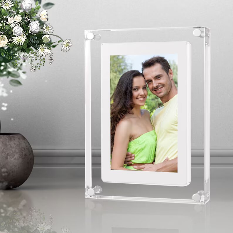 Customizable acrylic motion video frame with motion sensor, rechargeable battery, and digital display for photos and videos.