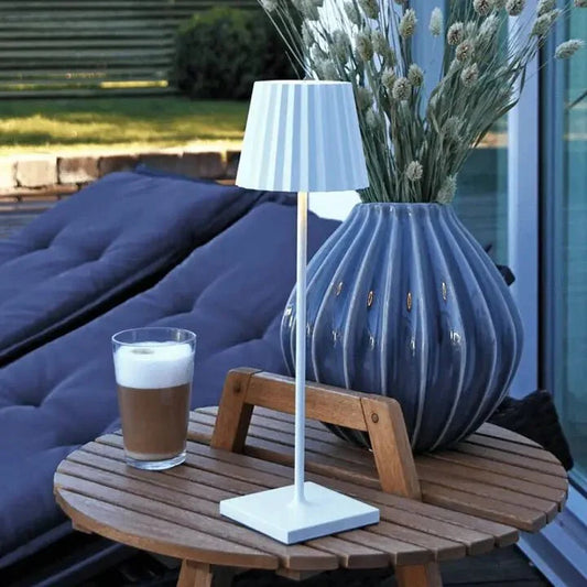 Modern rechargeable LED table lamp with waterproof design, dimmable lighting, portable and cordless, perfect for indoor and outdoor ambiance.